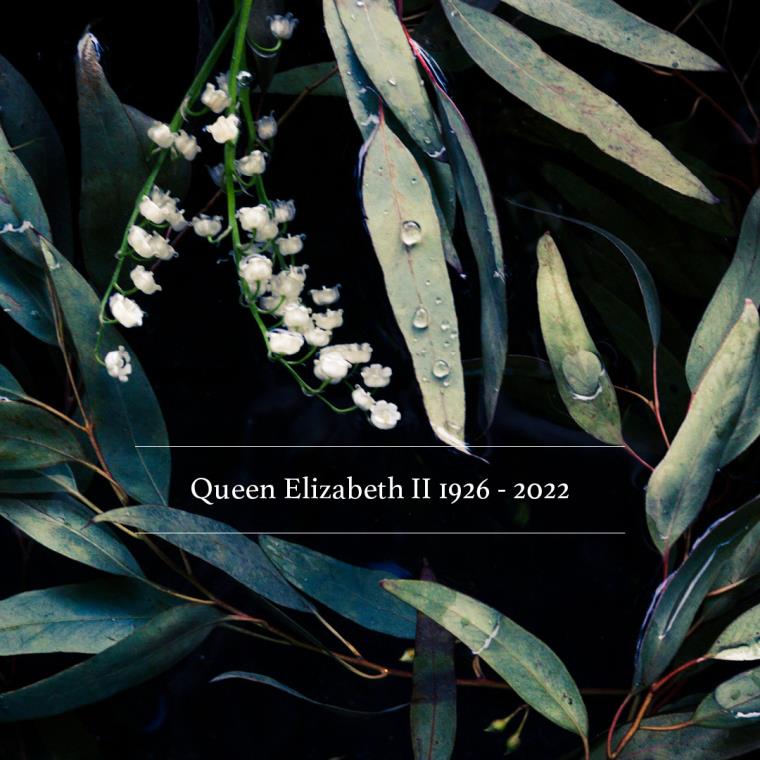 Lily of the valley flowers in background with words 'Queen Elizabeth II 1929 to 2022'.