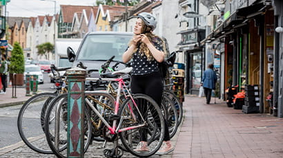 Young person or student cycling as a form of transport