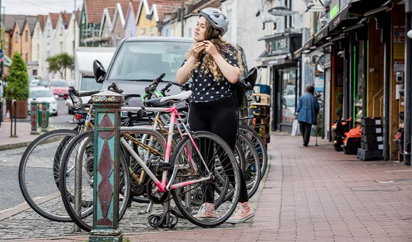 Young person or student cycling as a form of transport