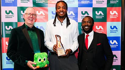 UWE Bristol’s Xavier Baker (EDI Business Partner) and Robiu Salisu (Assistant Director – EDI) collecting the award at the University Alliance Awards ceremony at the University of Derby