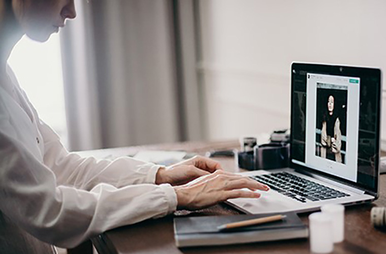 A student using a laptop.