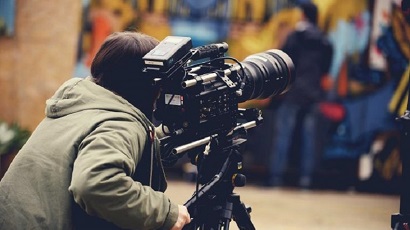 Person operating a film camera