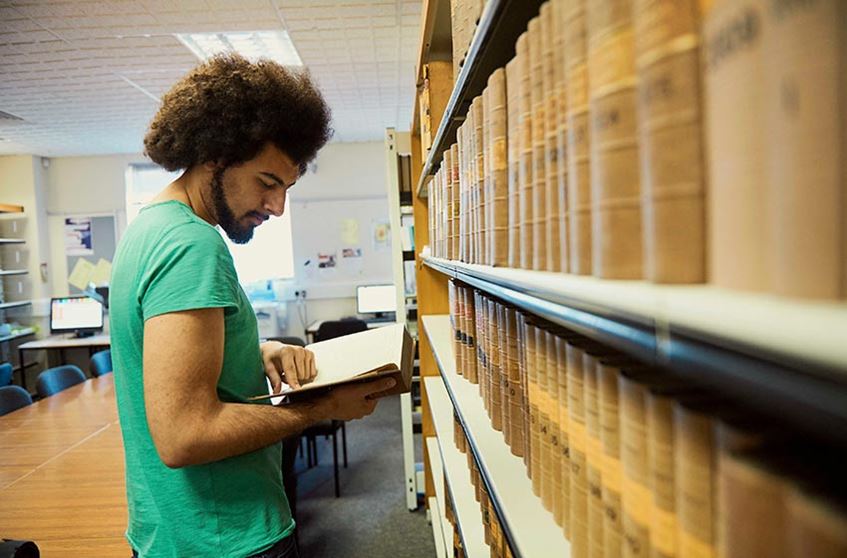 Student working in a library.