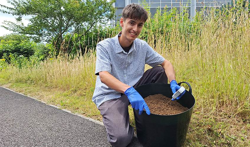 A student at UWE Bristol is testing soil with a sustainable fertiliser made from urine.