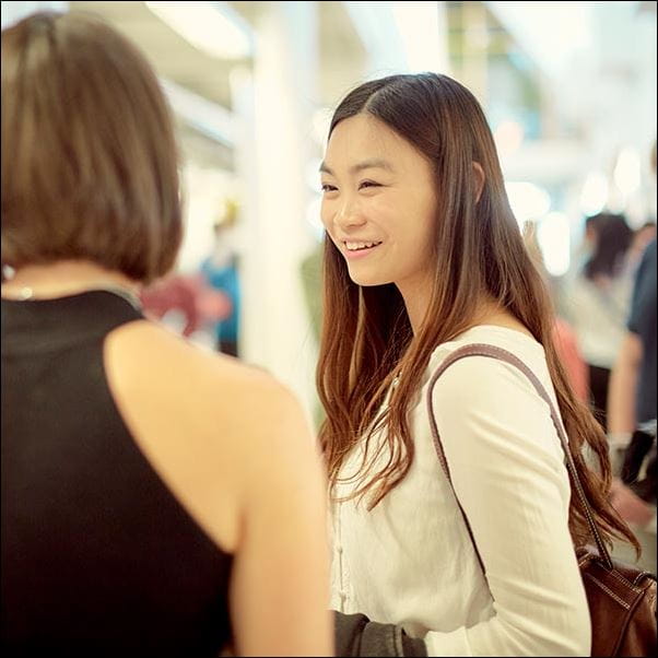 Student smiling at her friend