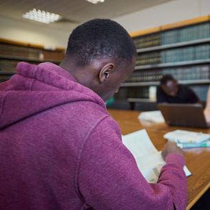 A student reading in the Library