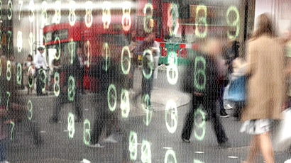 Busy city street scene with overlapping numbers of ones and zeros overlaid with glowing computer numbers.