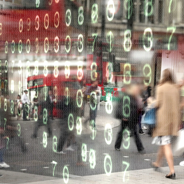 Busy city street scene with overlapping numbers of ones and zeros overlaid with glowing computer numbers. 