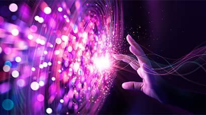 Abstract image of a big data network and pink cyber ​​particles that are distributed and circulating within the system.