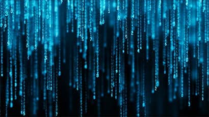 Visualisation of strings of data in blue flowing down in a matrix style against a dark background.