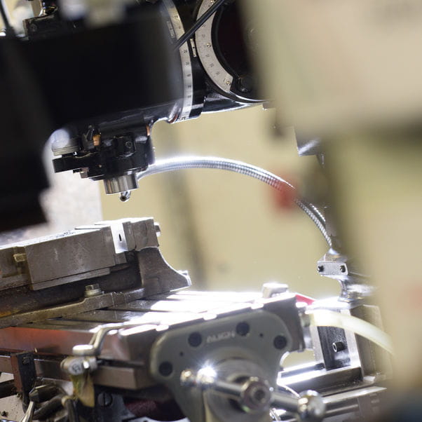 Close up shot of an engineering machine tool with metal components.