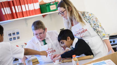 Student on teaching placement with school children