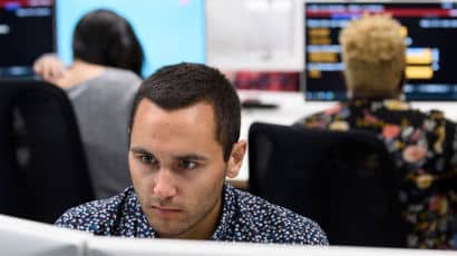 Students using computers in a study lab.