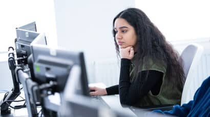 Person concentrating while using a computer