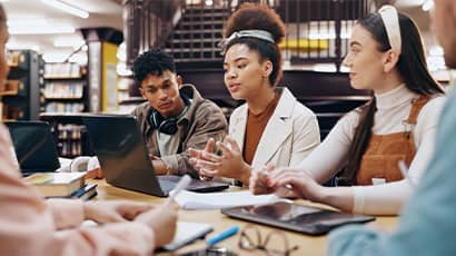 A research team discussing a project around a table.