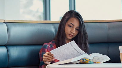 Student reading textbook