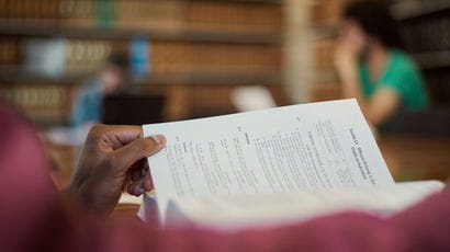 Researcher looks at papers