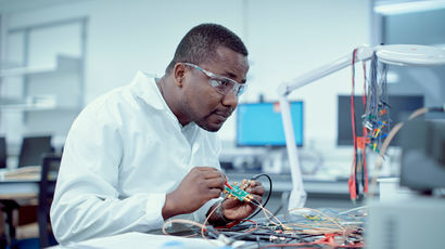 Researcher in a lab using specialist equipment