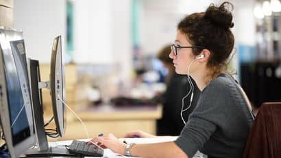 A researcher looks at a computer