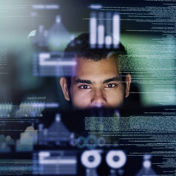 Cropped shot of a young computer programmer looking through data.