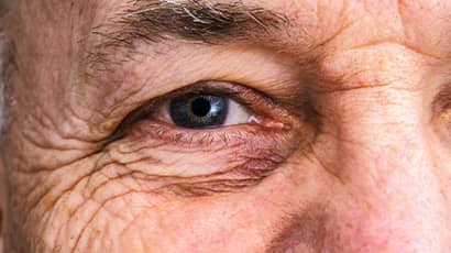 Close up a senior man's eye.