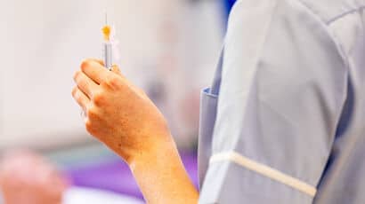 Nurse holding a syringe