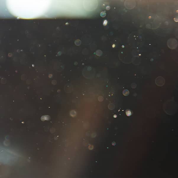 Dust particles floating in the air.