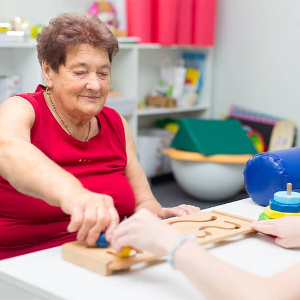 Stroke patient taking part in recovery exercises for motor skills.
