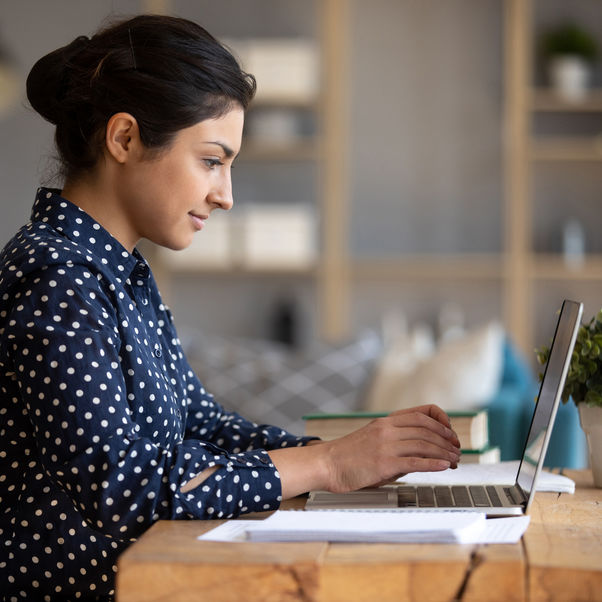 A student at home on a laptop