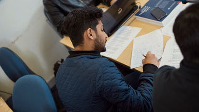 Student filling in exam paper