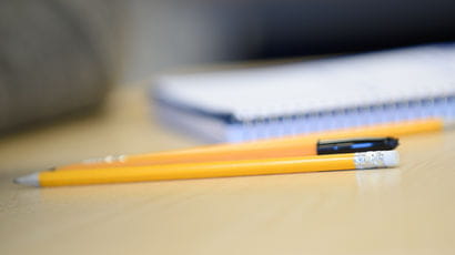 Pens and paper on a desk