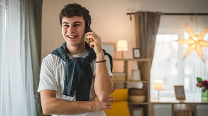 Student on the phone in their home.