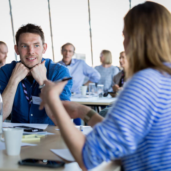 Male student at a conference.