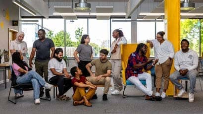 Equity identity coaches sat chatting as a team.