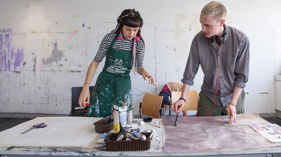 Student artists in a studio.