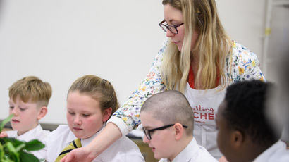 Student teacher working with children.