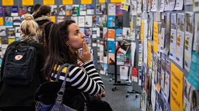 Student looking at job opportunities at a career fair.