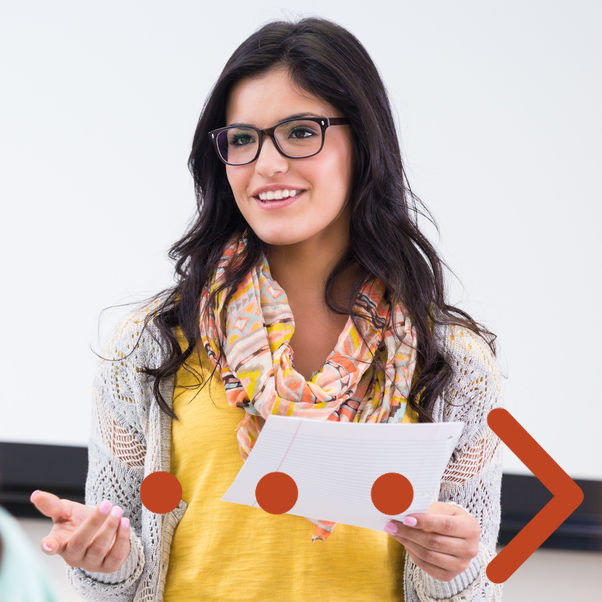 A female student reading from a piece of paper