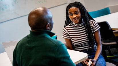 Student talking with their equity mentor.