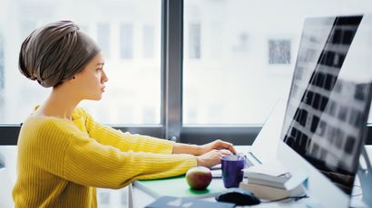 A student working on a laptop.