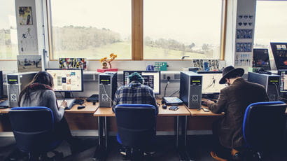 Three students using computers at Bower Ashton Campus