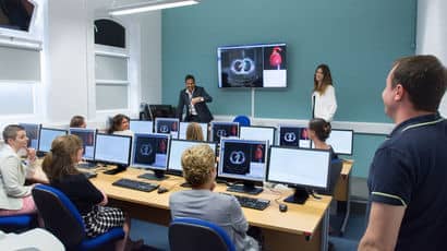 A classroom of students using computers at Glenside Campus