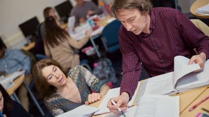 Teacher looks at legal paperwork