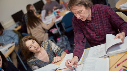 Teacher looks at legal paperwork