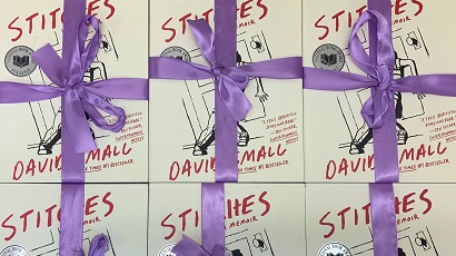 Photo of books wrapped in ribbon.