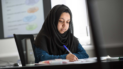 Student working at a desk.