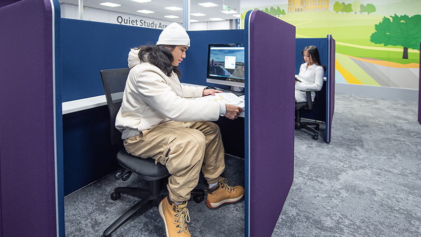 Student working in silent study pod in Glenside Library