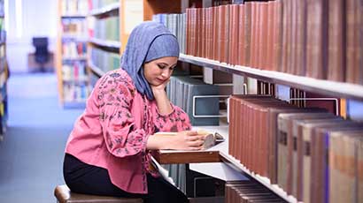 Student using law books.