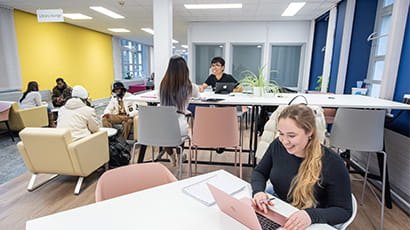 Wide shot of students working in Glenside Library