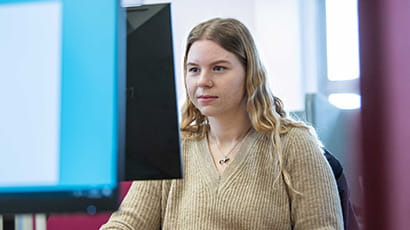 Student looking at desktop computer screen